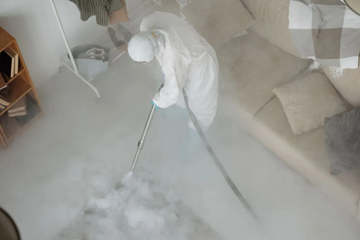 Biohazard cleanup technician in protective equipment, Pinehurst, MA